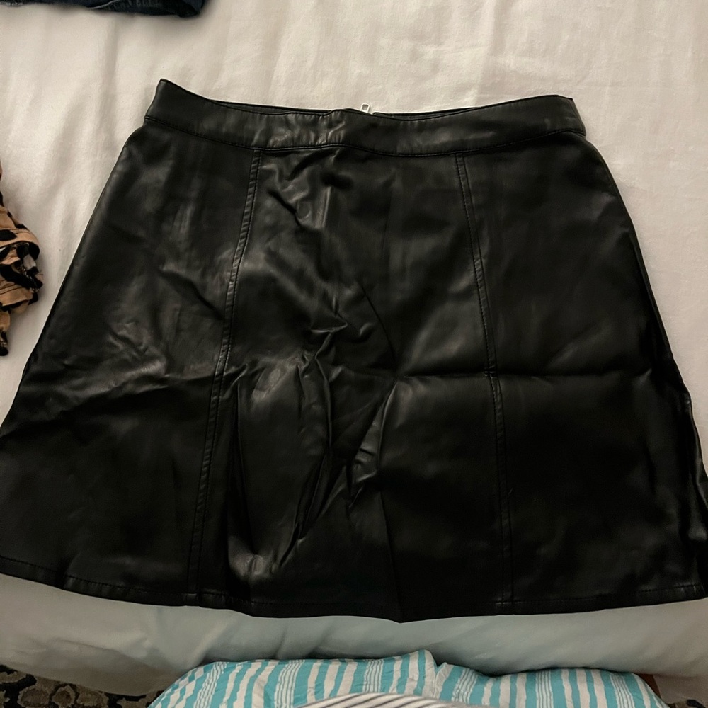 Black faux leather skirt.